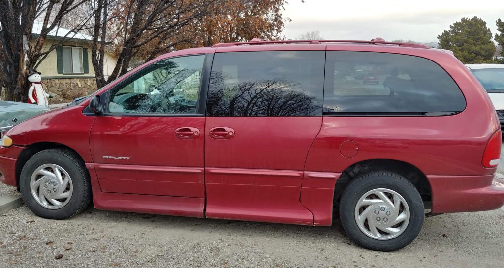 Sarah's bright red accessible minivan.