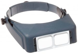 An early wearable magnifier called an Optivisor.